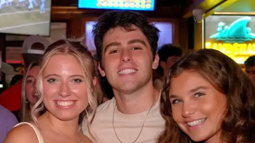 Joshua with friends at a football tailgate